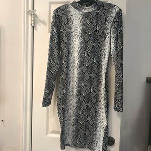 Black and white snake dress. Form fitting.